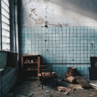 Explore the rustic charm of an abandoned room with worn furniture and scattered debris in Sankt-Peterburg.